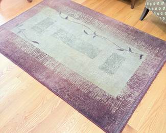 V58 - $50. Area RugMeasures 69” x 47”.