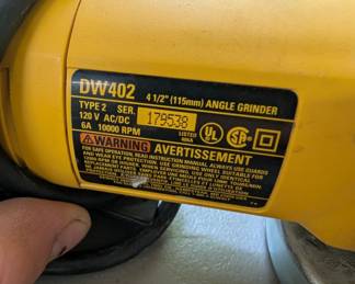 V151 - $30. Dewalt DW402 4.5" Angle Grinder.