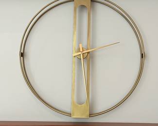 V9 - $75. Large Gold Wall Clock by Kare Design. Measures 42” Diameter.
