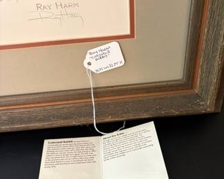 V89 - $50. “Cottontail Rabbit” by Ray Harm. Signed Print. Measures 28.75” x 32.25”.