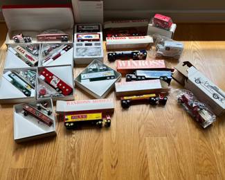 V39 - $160. Lot of 16 Winross Model Trucks and 2 Coin Banks. All new.