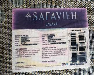 V46 - $50. Safavieh 8' x 10' "Cabana" grey/navy rug patio rug.