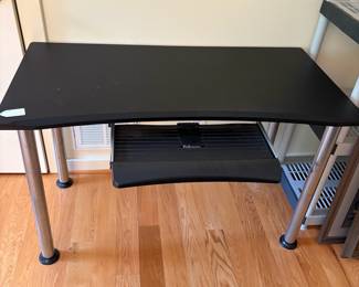 V86 - $30. Computer desk. Measures 47.25” x 23.5” x 29.5” Tall.