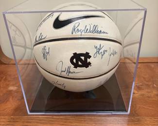 V104 - $250. 2010-2011 Season UNC Signed Basket Ball in Display Case. Signed by Players and Coaches.