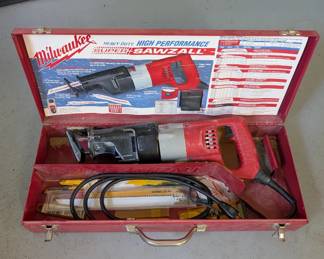 V154 - $60. Milwaukee Sawzall Corded with metal case & extra blades.