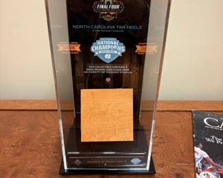V105 - $40. North Carolina Tar Heels Final Four Phoenix 2017. Authentic piece of court from University of Phoenix Stadium in display case.