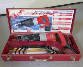 V154 - Milwaukee Sawzall Corded with metal case & extra blades.