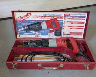 V154 - $60. Milwaukee Sawzall Corded with metal case & extra blades.