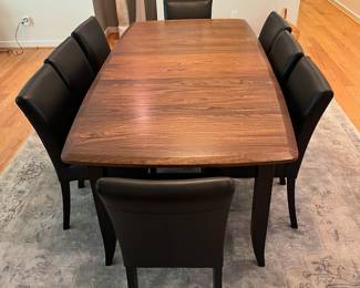 SET INFO (Priced separately V3 & V4) V3 - $2000. Amish Made Barkman Furniture - Holmes County Ohio. "Christy" Model - 66" Ext. Table. Grey Elm & Brown Maple. Measures 42” Wide x 66” Long x 30.5” Tall. Leaf measures 18”. Total table length with leaf is 84”. Excellent condition. V4 - $1600. Set of 8 Crate and Barrel Lowe Onyx Dining Chairs with Ebony Legs. Measures 18.5” Wide x 19” Deep x Floor to seat 19” x Floor to back 35” Tall. All in Excellent Condition.