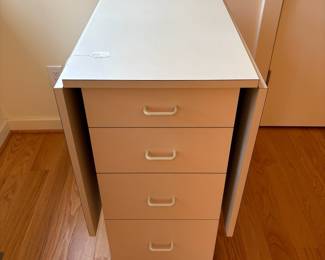 V82 - $125. Drop Leaf Sewing Craft Table. Measures 19.25” x 33” x 33.5” Tall. With both leaves it measures 61” long.