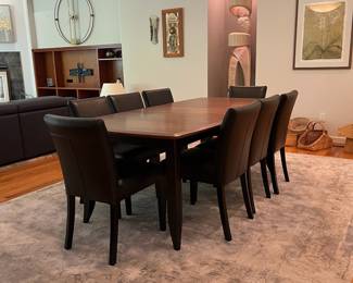 SET INFO (Priced separately V3 & V4) V3 - $2000. Amish Made Barkman Furniture - Holmes County Ohio. "Christy" Model - 66" Ext. Table. Grey Elm & Brown Maple. Measures 42” Wide x 66” Long x 30.5” Tall. Leaf measures 18”. Total table length with leaf is 84”. Excellent condition. V4 - $1600. Set of 8 Crate and Barrel Lowe Onyx Dining Chairs with Ebony Legs. Measures 18.5” Wide x 19” Deep x Floor to seat 19” x Floor to back 35” Tall. All in Excellent Condition.