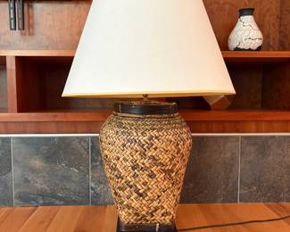 V51 - $40. Large Rattan Base Table Lamp. Shade is in good condition. Measures 36” Tall.