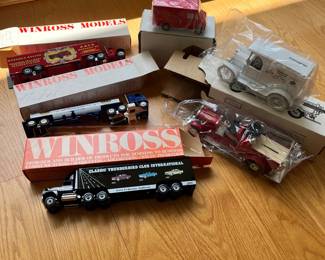 V39 - $160. Lot of 16 Winross Model Trucks and 2 Coin Banks. All new.