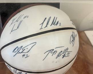 V104 - $250. 2010-2011 Season UNC Signed Basket Ball in Display Case. Signed by Players and Coaches.