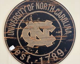 V99 - $20. UNC Wooden Wall Sign. Measures 23” Diameter. Heritage Logo Design.