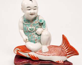 Lot 402: Chinese Famille Rose Porcelain Boy on Carp Figure