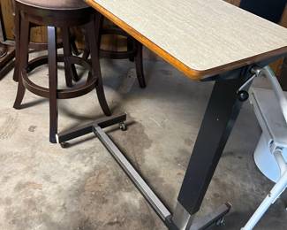 #117 Adjustable Bedside Table on Metal Base with Wheels - 34x16 and adjustable height $30.00