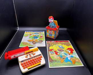 Vintage Puzzles And Toys Featuring A Tomy Tutor Typer And A Mattel Jack In The Box