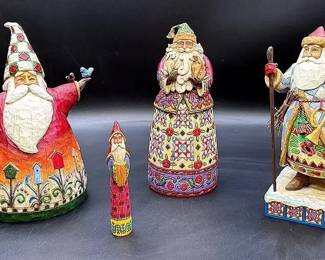 A Collection Of Four Decorative Jim Shore Santa Figures