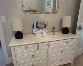 White dresser and gold framed mirror