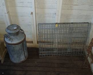 **Photo — Antique Milk Can & Wire Cage** **Tags:** antique milk can, galvanized cream can, farmhouse decor, primitive farm collectible, vintage wire cage, rabbit hutch, chicken coop wire panel A great primitive find for farmhouse or rustic decor: a large galvanized antique milk/cream can with lidded top and side handles, priced at $30, alongside a heavy-gauge vintage wire cage panel — ideal for repurposing as farm decor, garden trellis, or small-animal housing.