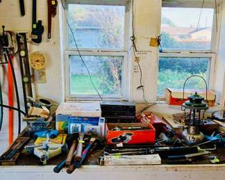 Vintage Radio & Workbench Tool Lot Tags: Coleman camping lantern, vintage stereo receiver, pipe wrenches, hammers, level, garage workbench, hand tools, sprinkler Another great vintage Coleman lantern sits on this well-used workbench, joined by a vintage stereo receiver, hand tools including hammers and pipe wrenches, a level, and assorted small hardware and boxed items. A practical, well-rounded tool lot for garage and workshop shoppers.