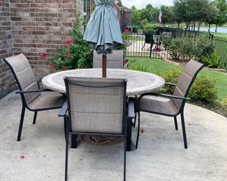 Patio table with stone top, fours chairs and umbrella
