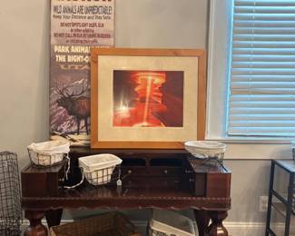 Wire baskets, artwork and wooden desk