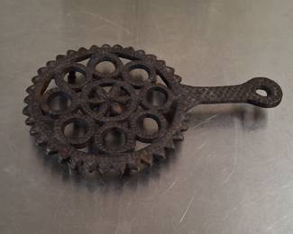Antique Cast Iron Trivet with Gear Edge and Starburst Center