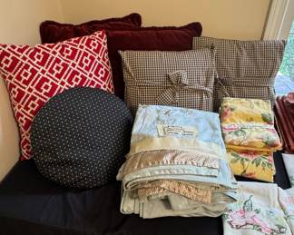 Assorted Linens and Decorative Pillows with Vintage Floral and Gingham Patterns