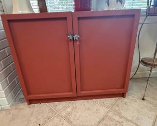 Red Two-Door Cabinet with Leaf-Shaped Pulls