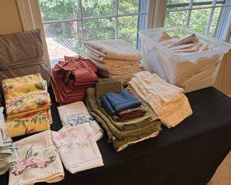 Assorted Linens and Decorative Pillows with Vintage Floral and Gingham Patterns