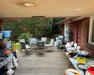 Outdoor dining set with six chairs plus cushions, outdoor pots for planting, tupperware, platters and bowls for serving, party supplies, and tools in the back shed!