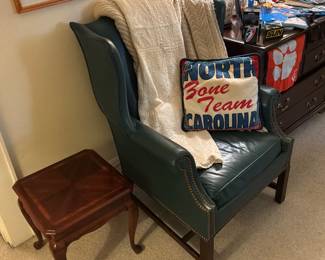 Green leather wingback chair and small Queen Anne style accent table 