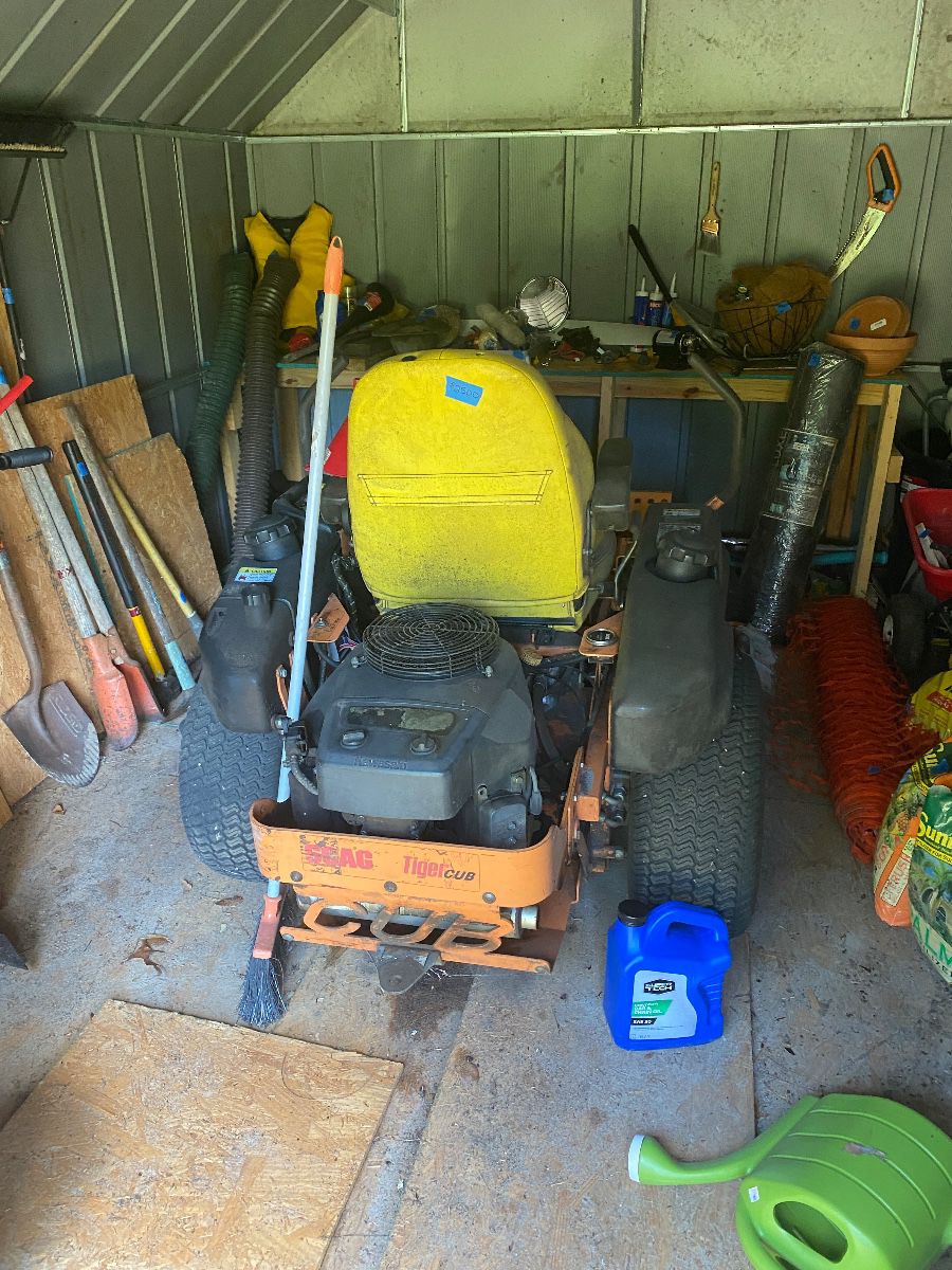 Packed out shed, including a tiger tub mower