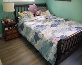 Double/full bed; nightstand; table lamp