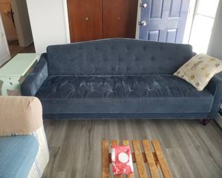 Luxe blue couch folds flat - sleeper sofa!