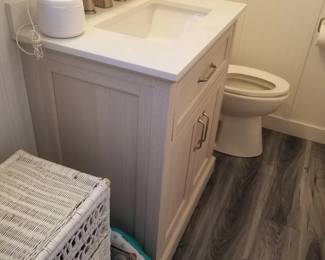 Bath vanity; wicker hamper