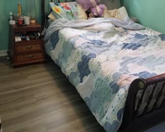 Double/full bed; nightstand; table lamp