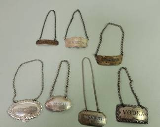 124 Rank 124 Lot 387 Seven sterling silver bottle tags
