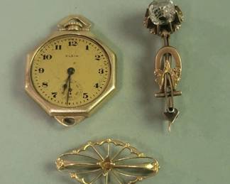 007 Rank 007 Lot 393 Pair of 10k gold brooches scratch tested, Elgin