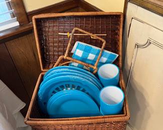 picnic basket and picnic dishes and blanket