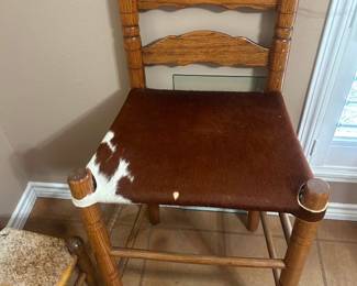 Genuine Cowhide Barstool  Excellent condition  25” tall to seat, 19” across x 15” deep 