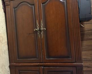 Armoire with side cabinets and glass shelves