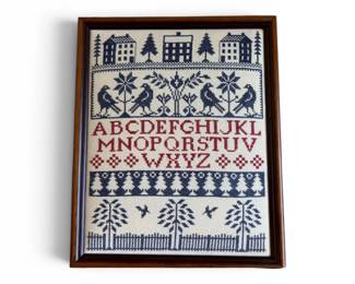 Framed embroidered sampler
