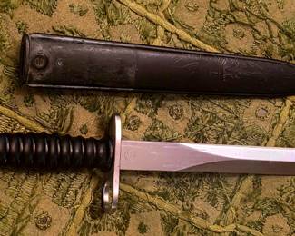 Swiss Model 1957 bayonet for the Stgw 57 / SIG 510 rifle, complete with its original-style metal scabbard. The circled W marking indicates Wenger manufacture. �
