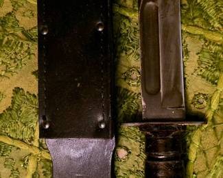 U.S. Air Force jet-pilot survival knife, likely made by Camillus or Ontario, with a stacked-leather handle.