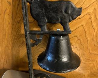 Cast iron bell with figural pig