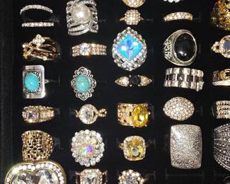 Vintage and fashion jewelry collection featuring rings, earrings, bracelets, necklaces, and accessories in gold and silver tone finishes