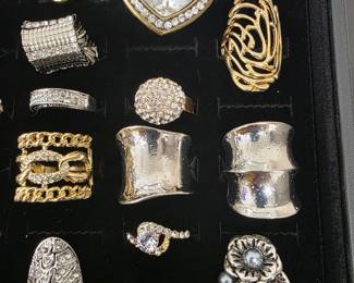Vintage and fashion jewelry collection featuring rings, earrings, bracelets, necklaces, and accessories in gold and silver tone finishes